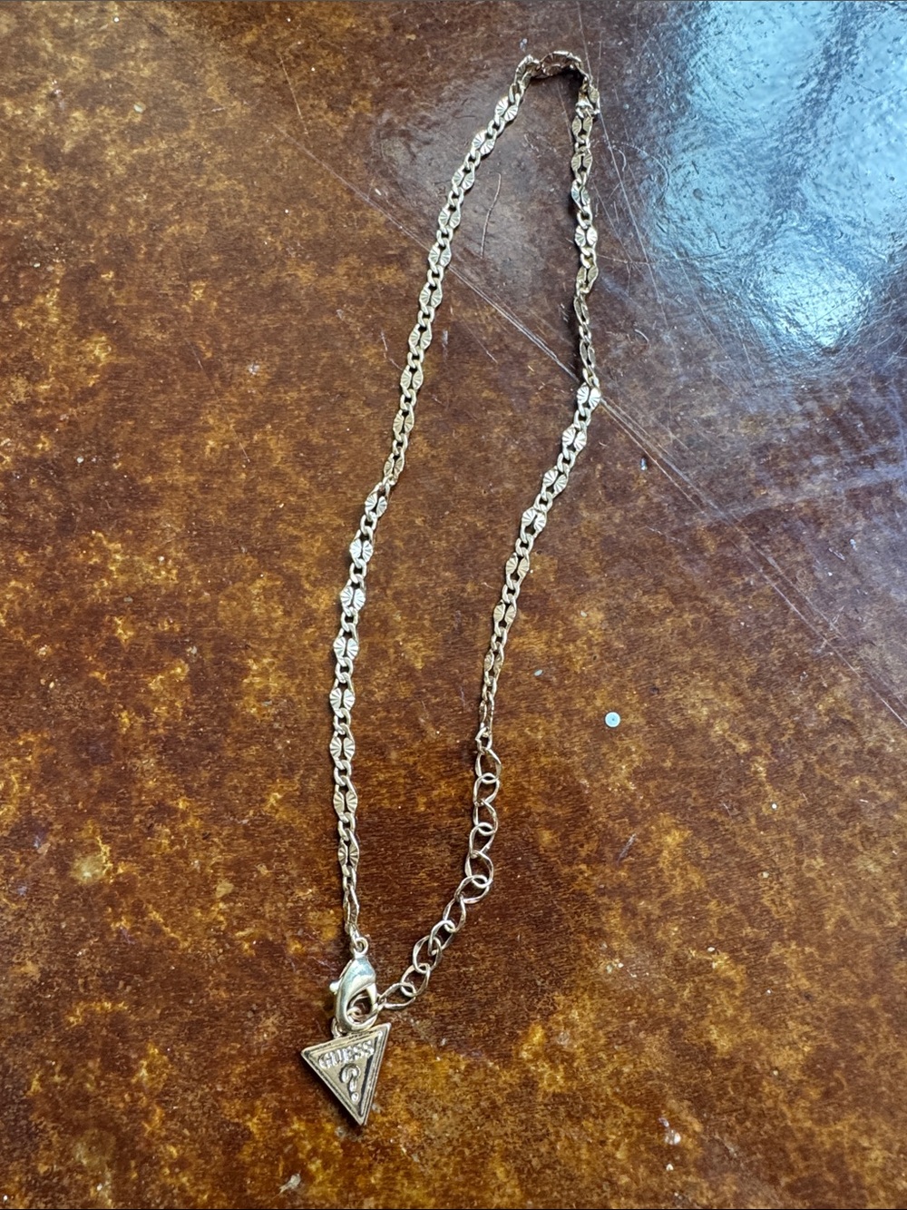 Guess Gold-Tone Triangle Logo Necklace